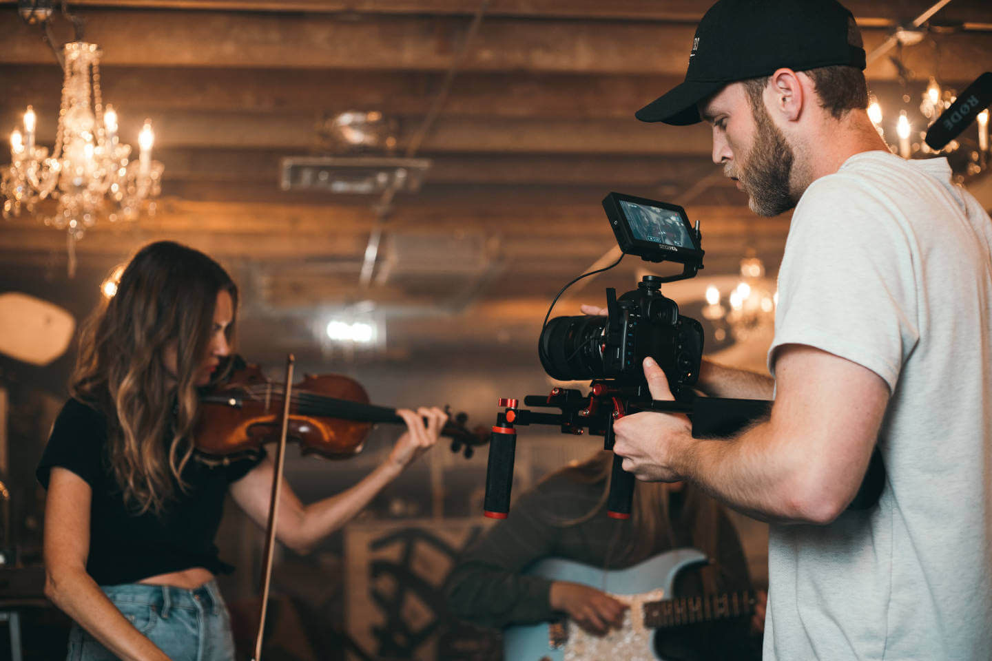 Camera Man filming musician